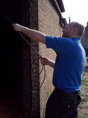 One of our qualified electricians pulling cable
