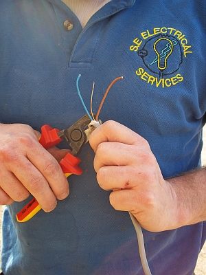 One of our qualified electricians preparing cable